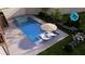 Overhead view of a backyard pool and hot tub with an umbrella table and lounge chairs at 375 Chattahoochee St, Roswell, GA 30075