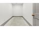 Simple storage room featuring concrete floor and base trim at 375 Chattahoochee St, Roswell, GA 30075