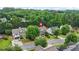 A stunning aerial view of a leafy neighborhood, highlighting this home and its tree-lined streets at 1037 Panoramic Pte, Buford, GA 30518