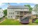 Large, lush backyard with a spacious deck and a trampoline at 1037 Panoramic Pte, Buford, GA 30518