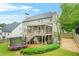 Private fenced backyard with a deck, screened porch, lush lawn, and plenty of space at 1037 Panoramic Pte, Buford, GA 30518