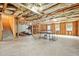 Spacious unfinished basement with exposed insulation, table tennis, and stairs at 1037 Panoramic Pte, Buford, GA 30518