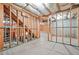 Unfinished basement with exposed beams, insulation, and concrete flooring, ready for customization at 1037 Panoramic Pte, Buford, GA 30518