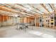 Spacious unfinished basement with concrete floor, offering a versatile space for recreation or storage at 1037 Panoramic Pte, Buford, GA 30518