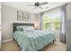 A bedroom with a large window and a comfortable-looking queen-sized bed at 1037 Panoramic Pte, Buford, GA 30518