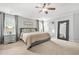 Beautiful bedroom featuring neutral walls, plush carpet, and a large decorative mirror at 1037 Panoramic Pte, Buford, GA 30518