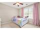 Charming bedroom with whimsical decor, a bright window, and comfortable carpet at 1037 Panoramic Pte, Buford, GA 30518