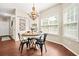 Cozy dining area with stylish lighting and views of the exterior, perfect for Gathering meals at 1037 Panoramic Pte, Buford, GA 30518