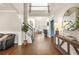 Welcoming foyer with hardwood floors, staircase, and view into the living room at 1037 Panoramic Pte, Buford, GA 30518