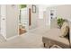 Hallway with carpet, bench, and view of bathroom; great layout and design for comfortable living at 1037 Panoramic Pte, Buford, GA 30518