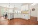 Bright eat-in kitchen featuring stainless steel appliances, white cabinets and plenty of natural light at 1037 Panoramic Pte, Buford, GA 30518