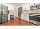 Updated kitchen with stainless steel appliances, stylish cabinets, and a chalkboard wall for personalized decor at 1037 Panoramic Pte, Buford, GA 30518