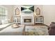 Warm living room showcasing a brick fireplace and decorative mantel accents at 1037 Panoramic Pte, Buford, GA 30518