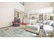 Open-concept living room seamlessly connects to the kitchen and dining area at 1037 Panoramic Pte, Buford, GA 30518