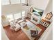 Stunning aerial view of living room with fireplace, large sectional, and expansive windows for natural light at 1037 Panoramic Pte, Buford, GA 30518