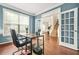 Bright home office featuring a large window, wood floors and french doors at 1037 Panoramic Pte, Buford, GA 30518