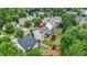 This home features a cozy backyard with a patio and is surrounded by lush trees at 1037 Panoramic Pte, Buford, GA 30518