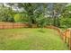 Spacious backyard featuring a well-maintained lawn and wood fence, offering privacy at 1393 Westview Sw Dr, Atlanta, GA 30310