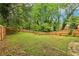 Large backyard is fenced in and features mature trees at 1393 Westview Sw Dr, Atlanta, GA 30310