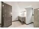Bathroom boasts a grey vanity with double sinks, hexagon tile flooring, and updated fixtures at 1393 Westview Sw Dr, Atlanta, GA 30310