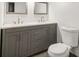 Bathroom featuring a grey double sink vanity, toilet and hexagon tile flooring at 1393 Westview Sw Dr, Atlanta, GA 30310