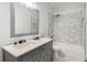 Modern bathroom features double vanity, tile shower and mosaic tile floor at 1393 Westview Sw Dr, Atlanta, GA 30310