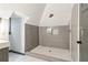 Modern bathroom features a walk-in shower with grey tiling and white hexagon tile flooring at 1393 Westview Sw Dr, Atlanta, GA 30310