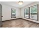Bright bedroom with wood-look flooring and large windows with natural light at 1393 Westview Sw Dr, Atlanta, GA 30310