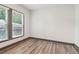 Bright bedroom with two windows, neutral walls, and hardwood-style flooring at 1393 Westview Sw Dr, Atlanta, GA 30310
