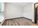 Neutral bedroom with hardwood-style flooring, natural light, and painted trim at 1393 Westview Sw Dr, Atlanta, GA 30310