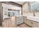 Open-concept kitchen featuring shaker cabinets, quartz counters, and views into the living area at 1393 Westview Sw Dr, Atlanta, GA 30310