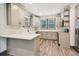 Modern kitchen with gray cabinets, quartz countertops, stainless steel appliances, and a stylish backsplash at 1393 Westview Sw Dr, Atlanta, GA 30310