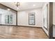 Bright open-concept living room with hardwood floors and modern lighting at 1393 Westview Sw Dr, Atlanta, GA 30310