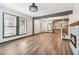 Bright open-concept living room with stone fireplace and hardwood floors at 1393 Westview Sw Dr, Atlanta, GA 30310