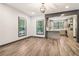 Bright open-concept living room with hardwood floors leading to a modern kitchen at 1393 Westview Sw Dr, Atlanta, GA 30310
