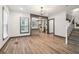 Bright open-concept living room with hardwood floors leading to a modern kitchen at 1393 Westview Sw Dr, Atlanta, GA 30310