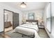 Staged bedroom with neutral decor and an en-suite bathroom view at 1393 Westview Sw Dr, Atlanta, GA 30310
