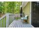 Outdoor deck with furniture and views of the backyard and trees at 2107 Sandtree Sw Ct, Atlanta, GA 30331