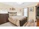 Comfortable bedroom with natural light and decorative accents at 2107 Sandtree Sw Ct, Atlanta, GA 30331