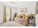 Cozy bedroom with natural light, stylish daybed and decorative accents at 2107 Sandtree Sw Ct, Atlanta, GA 30331