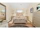 Stylishly decorated bedroom features neutral tones, eye-catching decor, and gleaming floors at 2107 Sandtree Sw Ct, Atlanta, GA 30331