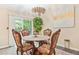 Cozy dining room features a round table and elegant chairs at 2107 Sandtree Sw Ct, Atlanta, GA 30331