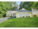 Inviting single-story home featuring a well-kept lawn and traditional design elements at 2107 Sandtree Sw Ct, Atlanta, GA 30331
