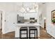 Bright kitchen with an island, stainless steel appliances, and stylish pendant lighting at 2107 Sandtree Sw Ct, Atlanta, GA 30331