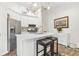 Bright kitchen with an island, stainless steel appliances, and stylish pendant lighting at 2107 Sandtree Sw Ct, Atlanta, GA 30331