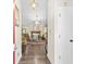 View of the bright, inviting living room from the front hallway, showcasing hardwood floors at 2107 Sandtree Sw Ct, Atlanta, GA 30331