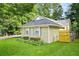 Cozy single-story home featuring a well-kept lawn and traditional design elements at 2107 Sandtree Sw Ct, Atlanta, GA 30331
