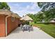 Angle view of the back deck with outdoor seating under an umbrella, perfect for relaxing or entertaining at 3060 Wilson Rd, Decatur, GA 30033