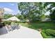 Wide angle view of back deck, with outdoor seating, surrounded by green grass at 3060 Wilson Rd, Decatur, GA 30033