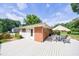 Wide angle view of the back deck with outdoor seating and a white wood finish on a sunny day at 3060 Wilson Rd, Decatur, GA 30033